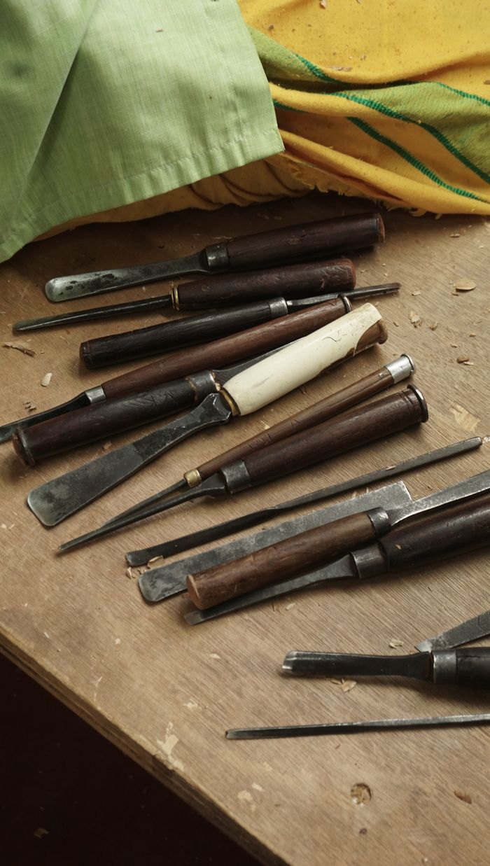 Mastering the First Impression: Your intriguing post title goes here A collection of woodworking chisels and tools in a traditional workshop setting in Bengaluru, India.